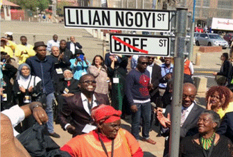 A picture containing text, person, outdoor, crowd

Description automatically generated